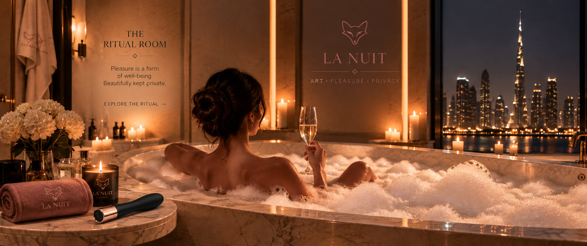The Ritual Room: a woman in a candlelit bath with a glass of champagne, city lights behind, La Nuit