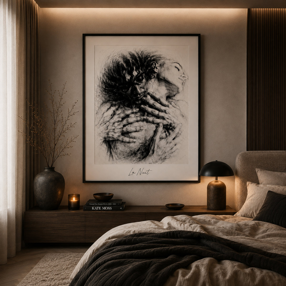 A framed La Nuit artwork in a candlelit room